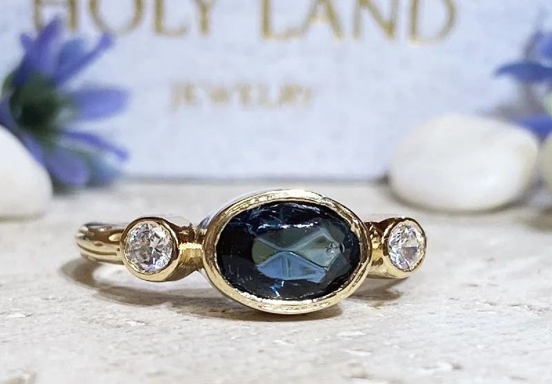 Iolite Gemstone Rings in 10K Gold with a Twisted Band for a Distinctive and Stylish AccessoryBlue Sapphire Ring - September Birthstone - Bezel Set Ring with Oval Blue Sapphire Gemstone and Clear Quartz Accents Iolite Gemstone Rings in 10K Gold with a Twisted Band for a Distinctive and Stylish AccessoryBlue Sapphire Ring - September Birthstone - Bezel Set Ring with Oval Blue Sapphire Gemstone and Clear Quartz Accents
